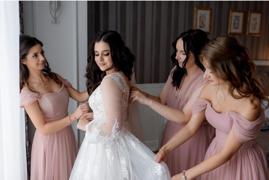 Bridesmaids helping the Bride Get Ready